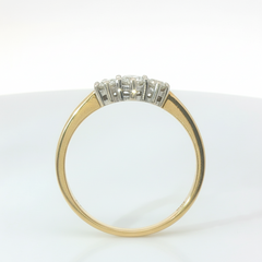 Round Brilliant 0.55TCW (2x0.15, 1 x 0.25) SI1 - SI2 H-I 18CT Yellow Gold Trilogy Ring Size T