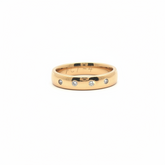 9k yellow gold band with four flush diamonds