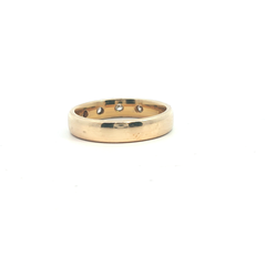 9k yellow gold band with four flush diamonds
