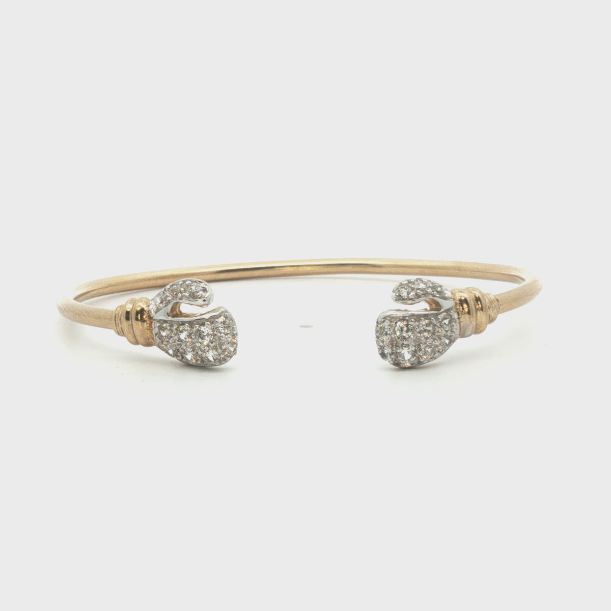 9ct - Pre owned - Boxing gloves torque bangle - 5.25"- (6.45g) - 2mm