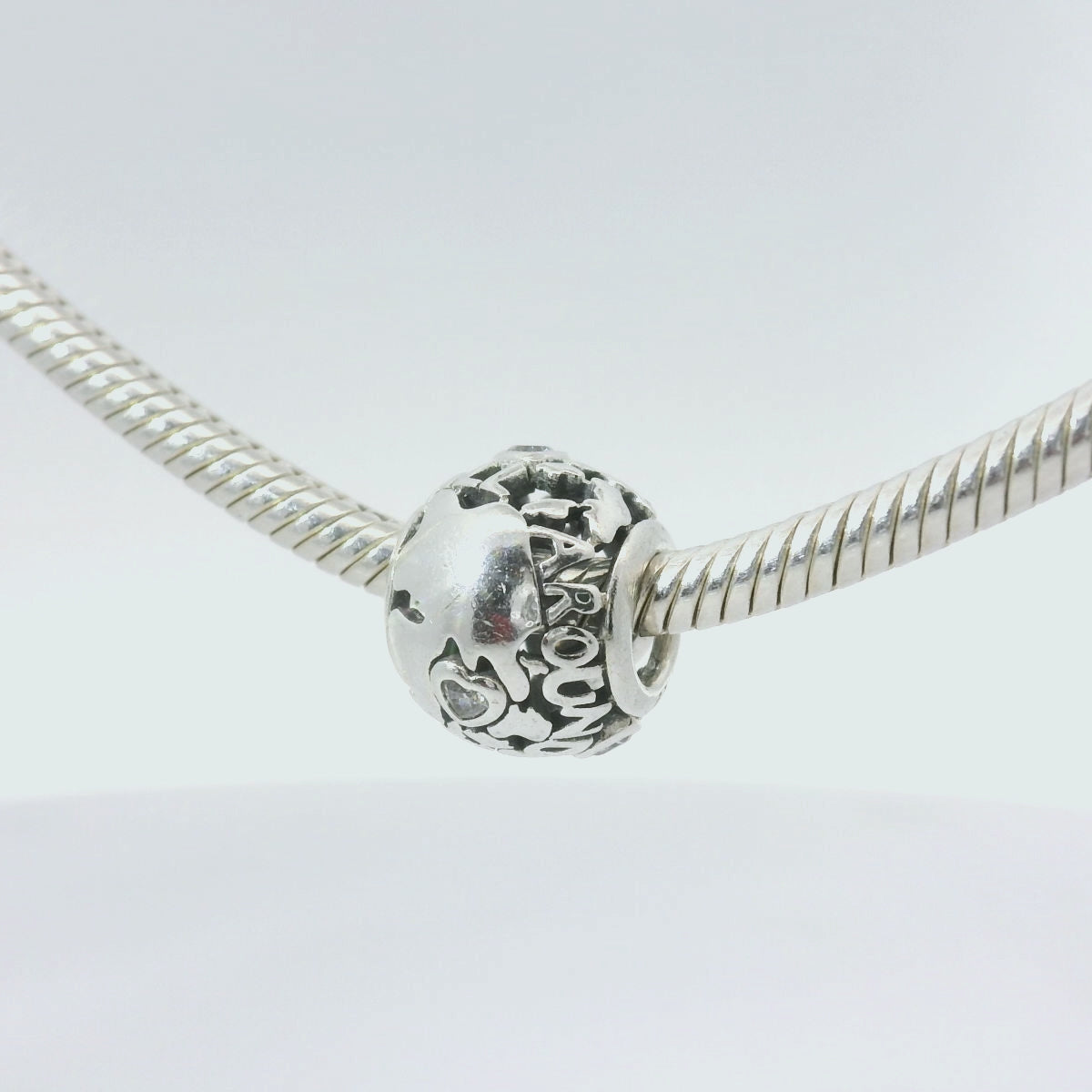 Genuine PANDORA 791718CZ Around The World Charm Only